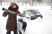 Removing Snow From Car in Harsh Winter